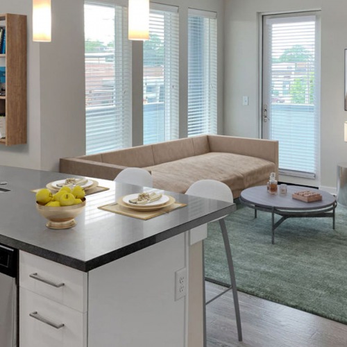 Maddox South End Living Space Large open concept kitchen and living room with balcony access
